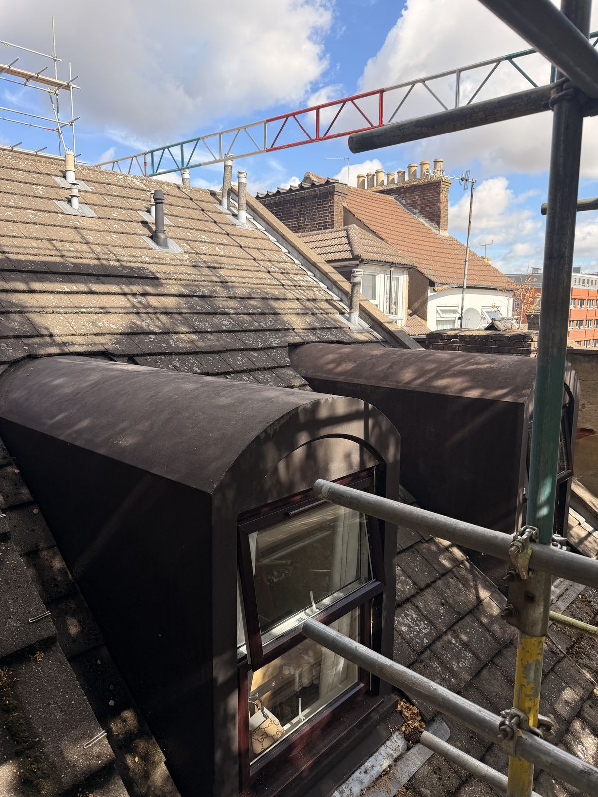 Pair of dome dormers on the pitched roof slope