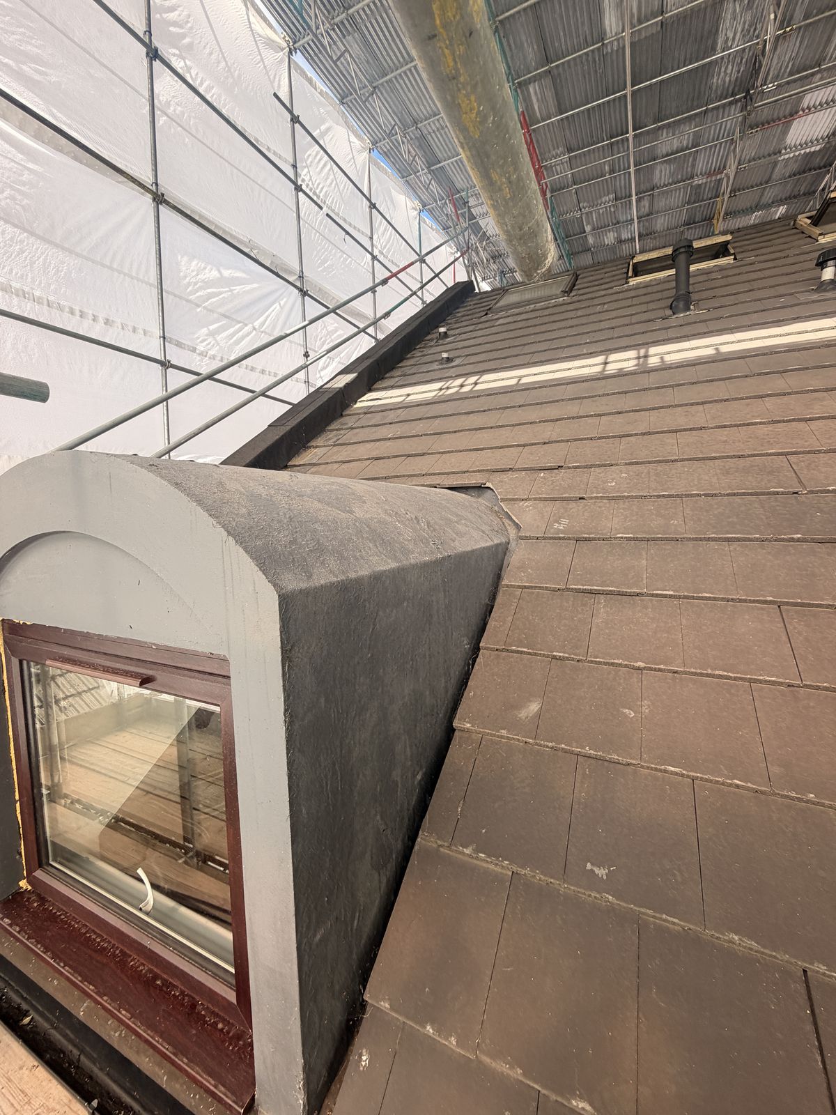 Dormer beneath the temporary roof structure