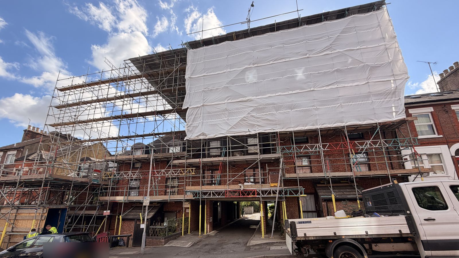 Scaffold and sheeting to the front elevation of the block