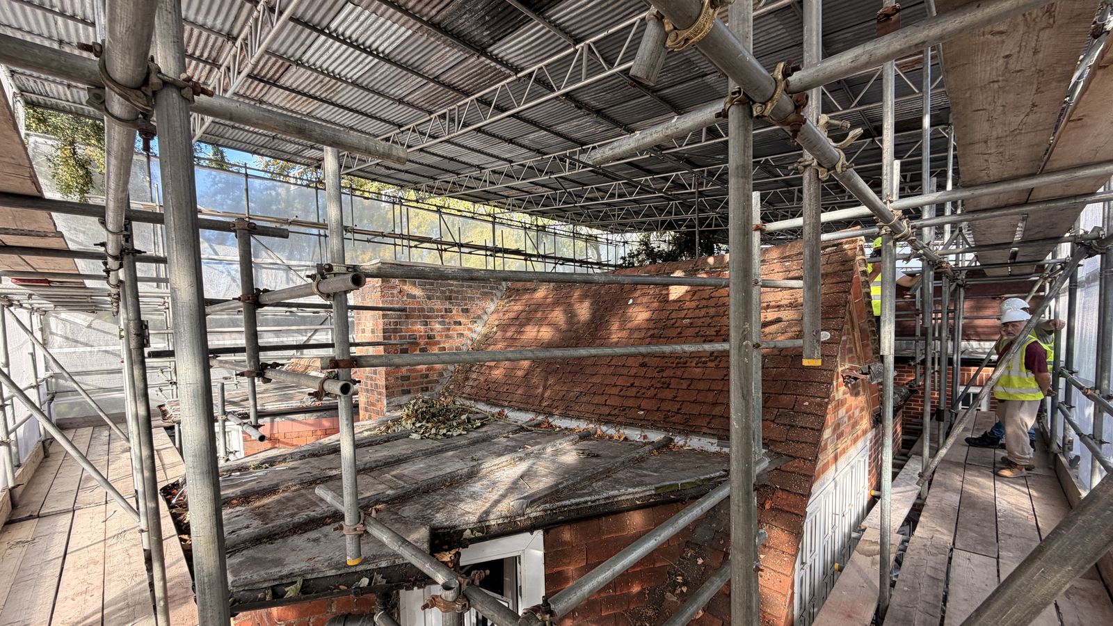Roof area enclosed beneath the temporary roof structure