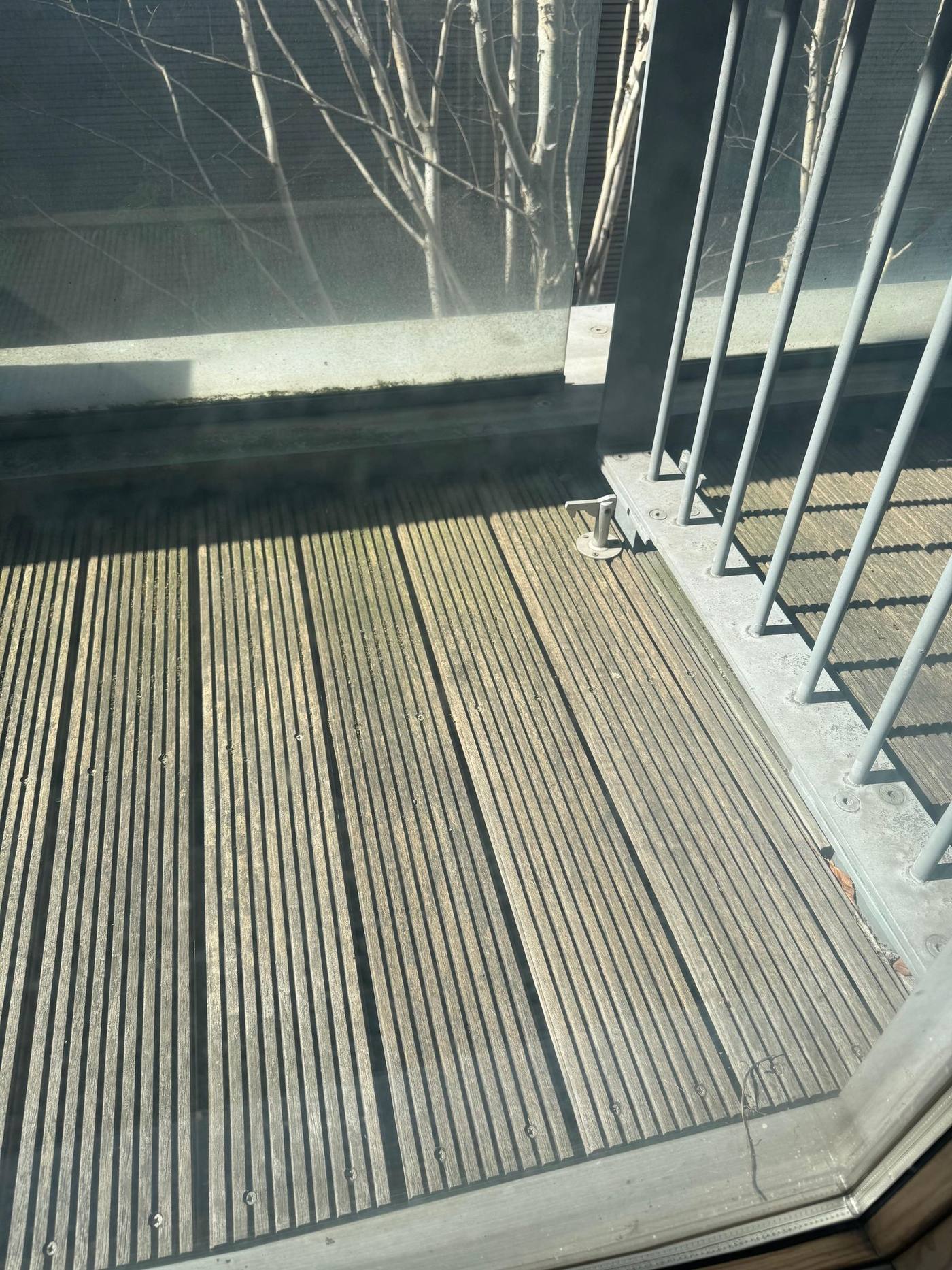 Original timber decking prior to works, showing weathering and surface degradation