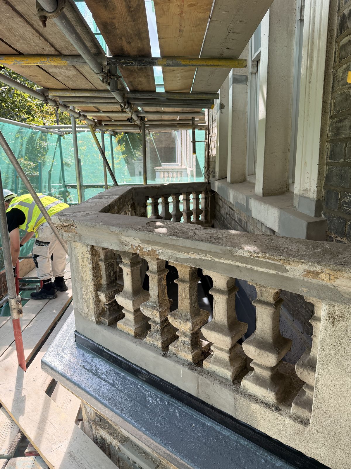 Ornate arched window surround with decorative enrichment
