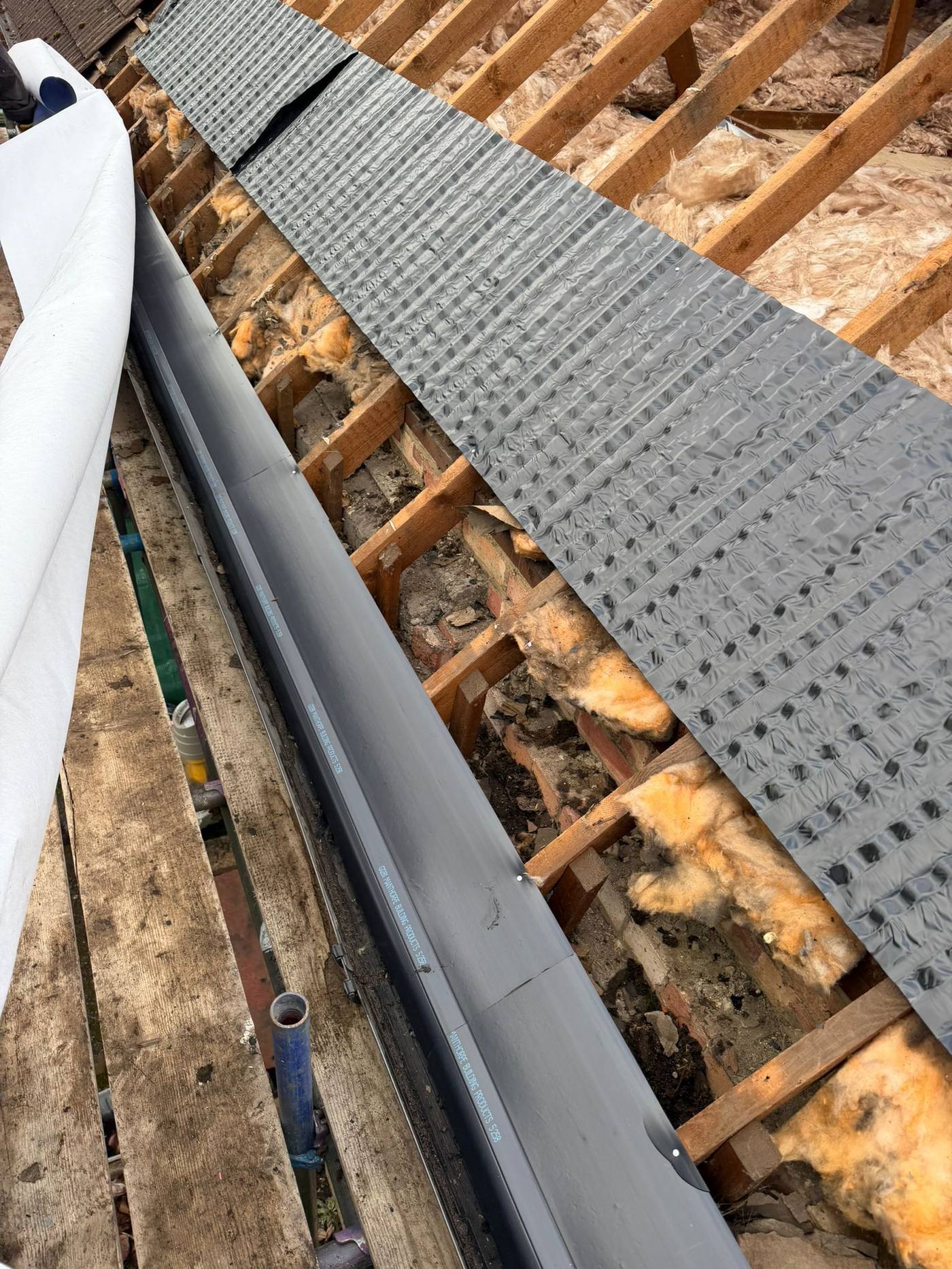 Eaves detail with new rainwater goods and eaves protection tray