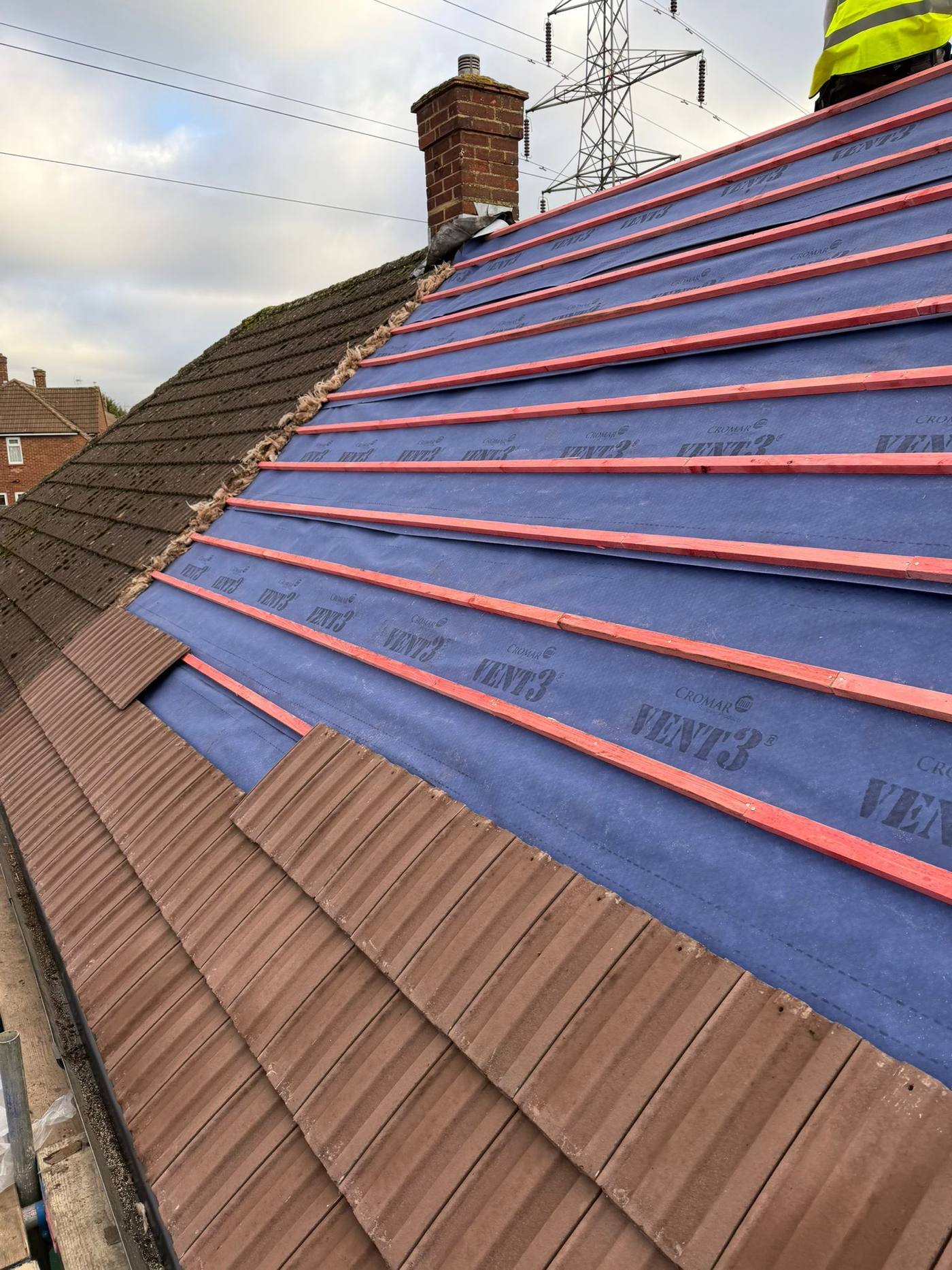 Re-tiling underway over battens