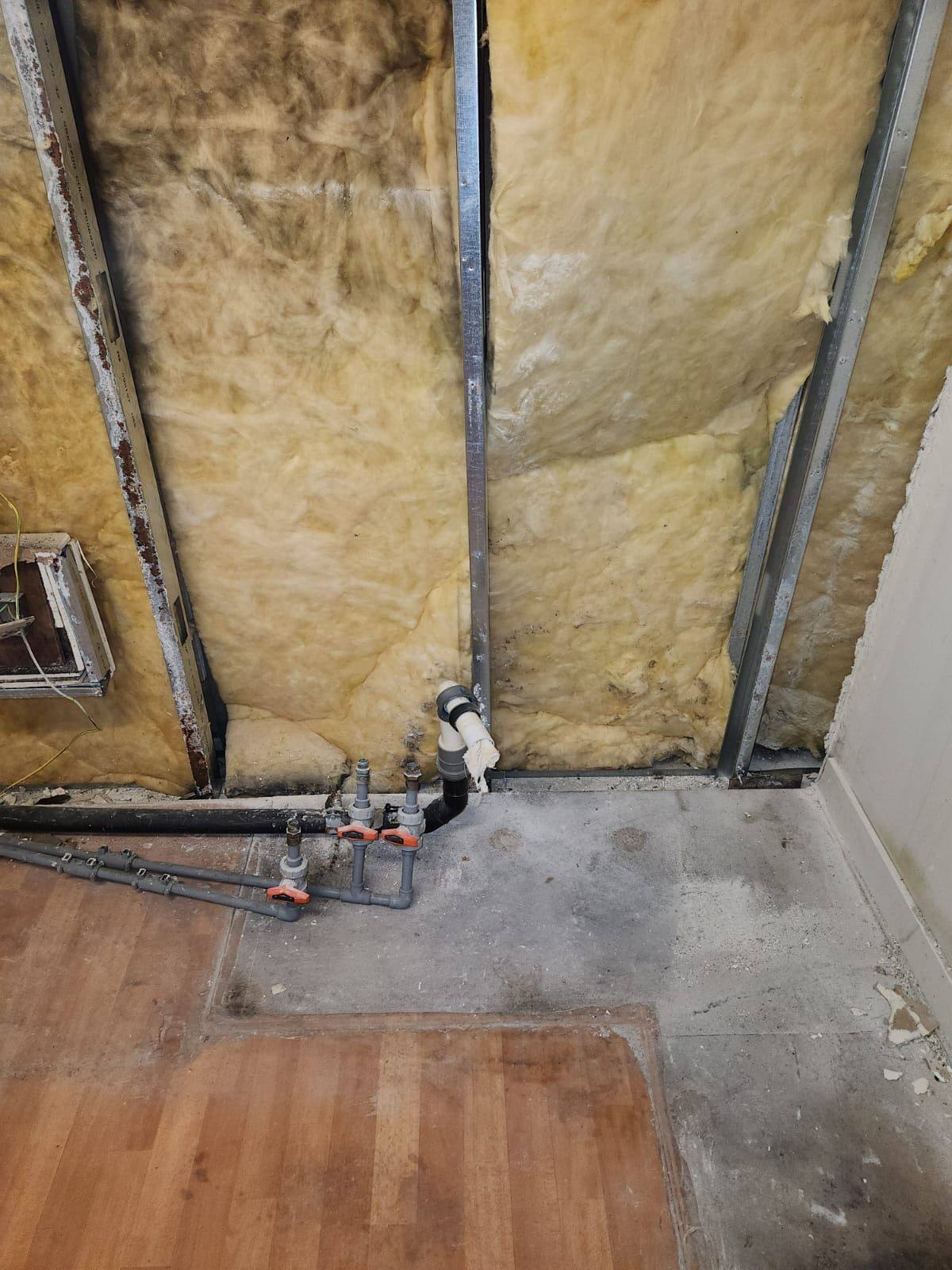 Studwork and services exposed after strip-out