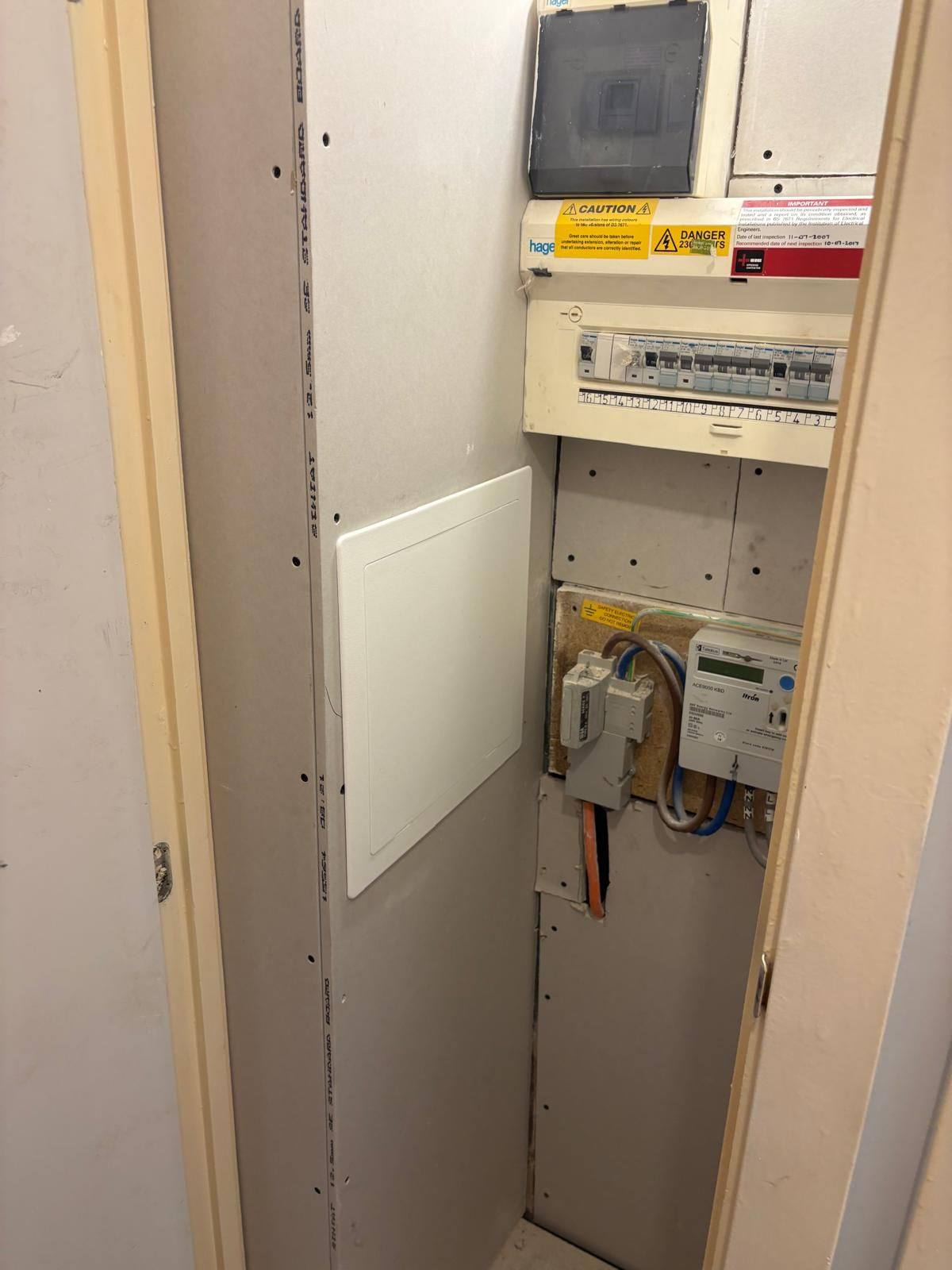 Consumer unit cupboard reboarded and made good